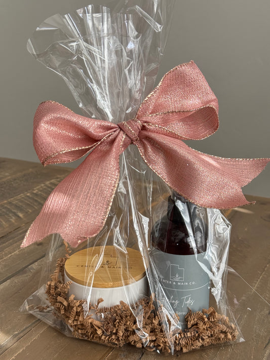 Luxury Candle Gift Set on table. Includes Scented Candle and Air Freshener Room Spray wrapped in gift bag.