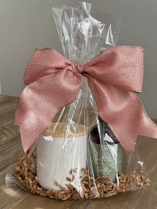 Luxury Candle Gift Set on table. Includes Scented Candle and Air Freshener Room Spray wrapped in gift bag.