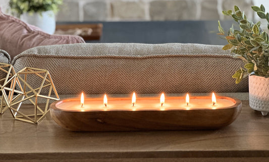Side View of a six wick luxury candle.  Wood dough bowl scented candle. 