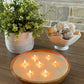 Top view of lit scented candle in front of fireplace. luxury candle on coffee table