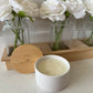 12 ounce three wick luxury ceramic jar candle with lid on the bathroom counter.  Top view of unlit scented candle with lid. 