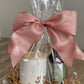 Luxury Candle Gift Set on table.  Includes Scented Candle and Air Freshener Room Spray wrapped in gift bag. 